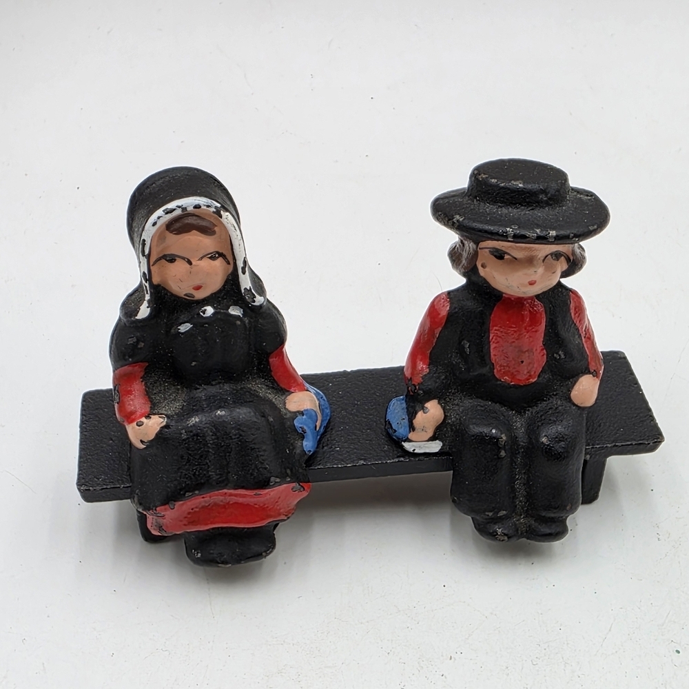 Vintage Cast Iron Painted Amish Man Woman On Bench